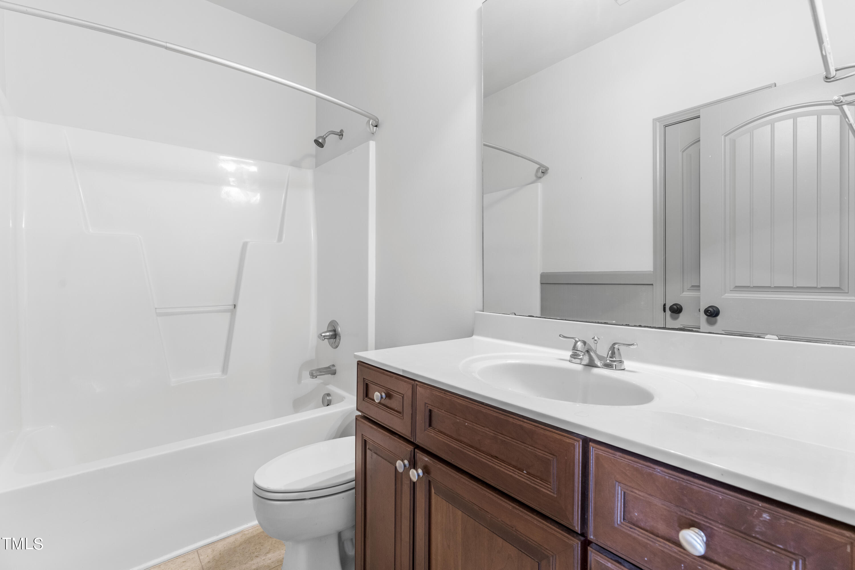 4419 Iyar Way Wake Forest, NC 27587 - Photo 21 of 26 a bathroom with a sink a toilet and shower