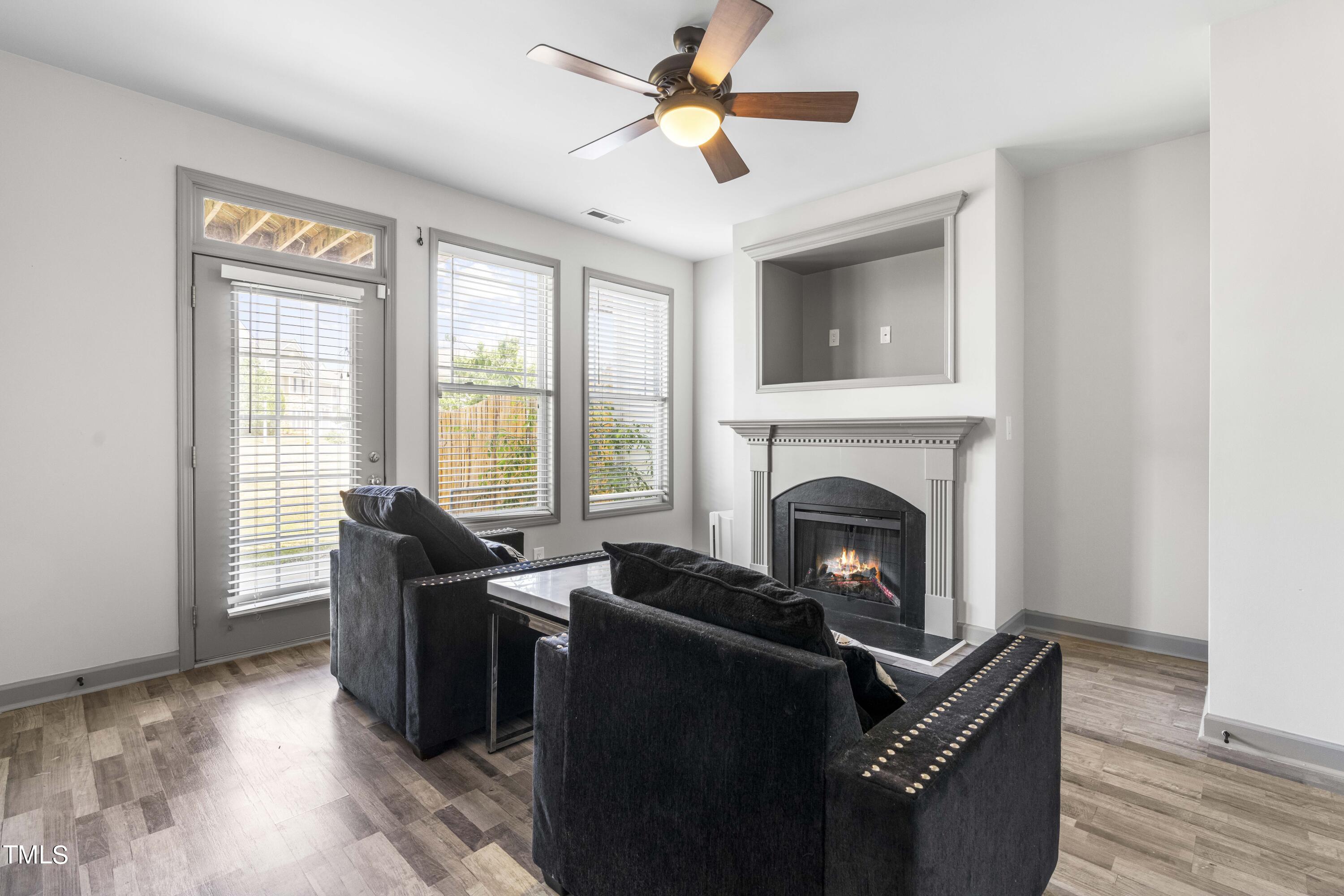 4419 Iyar Way Wake Forest, NC 27587 - Photo 5 of 26 a living room with furniture and a fireplace