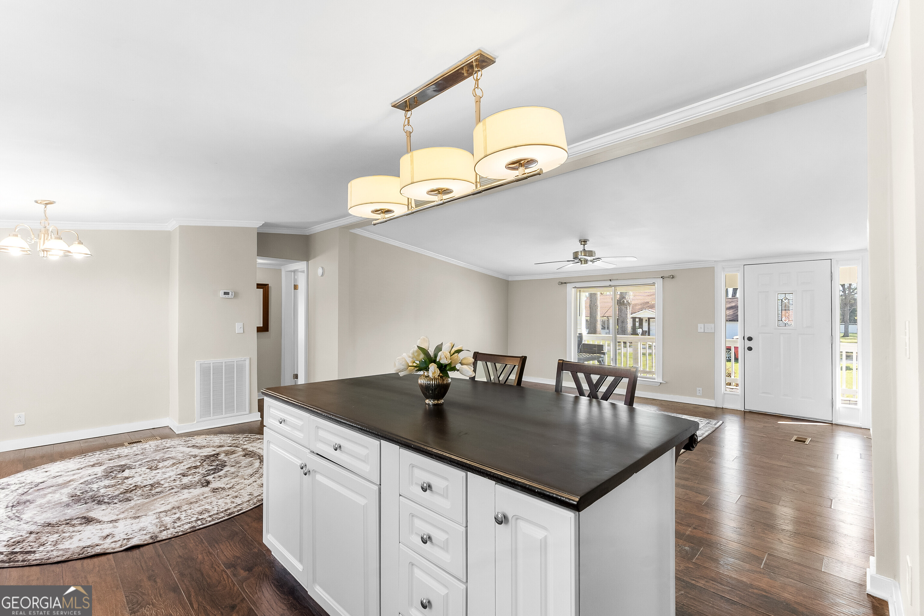 129 Walnut Street Bonaire, GA 31005 - Photo 13 of 31 a kitchen with center island table and chairs in it