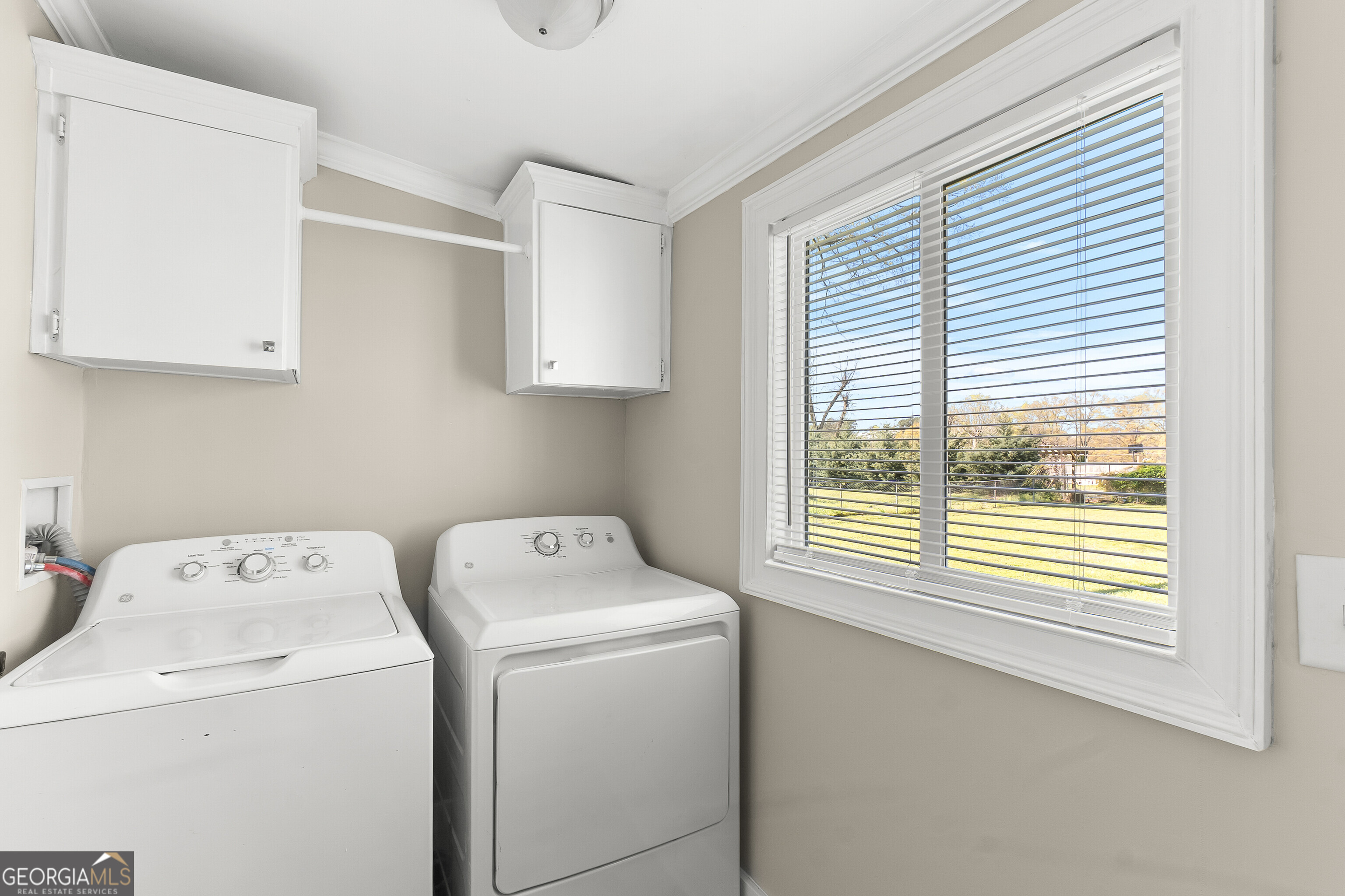 129 Walnut Street Bonaire, GA 31005 - Photo 15 of 31 a utility room with dryer and washer