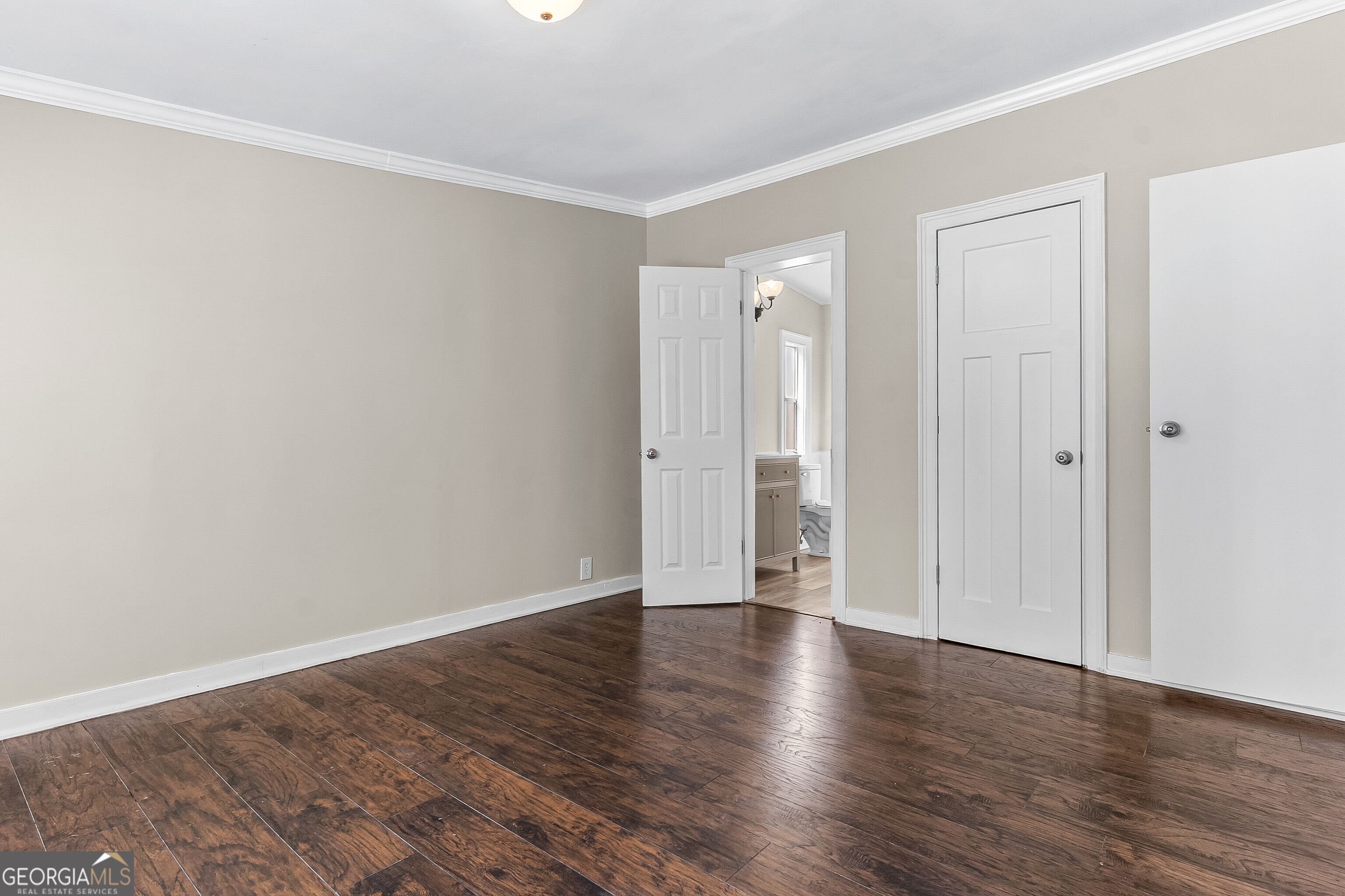 129 Walnut Street Bonaire, GA 31005 - Photo 17 of 31 a view of an empty room with wooden floor