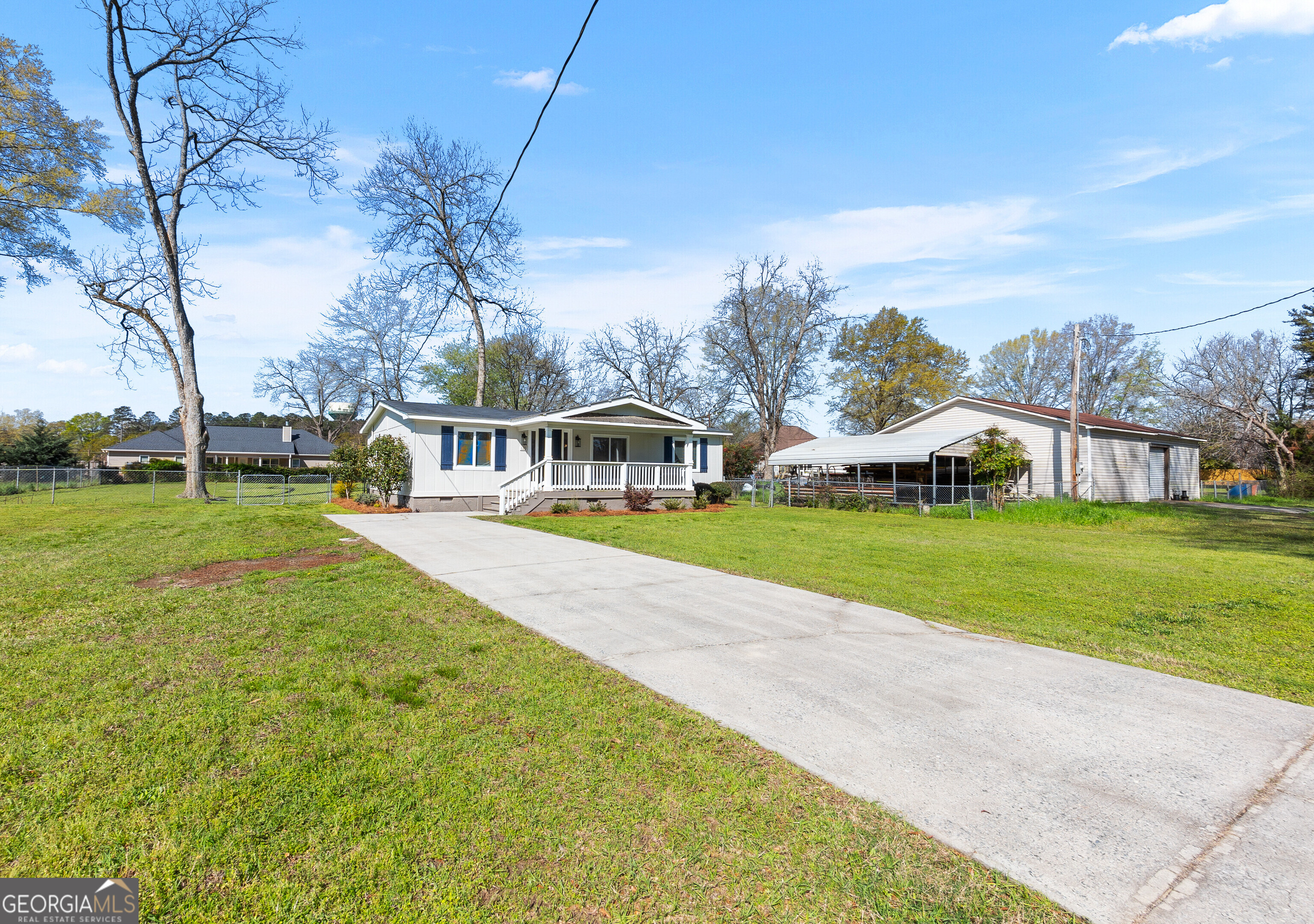 129 Walnut Street Bonaire, GA 31005 - Photo 2 of 31 a view of yard with swimming pool and green space
