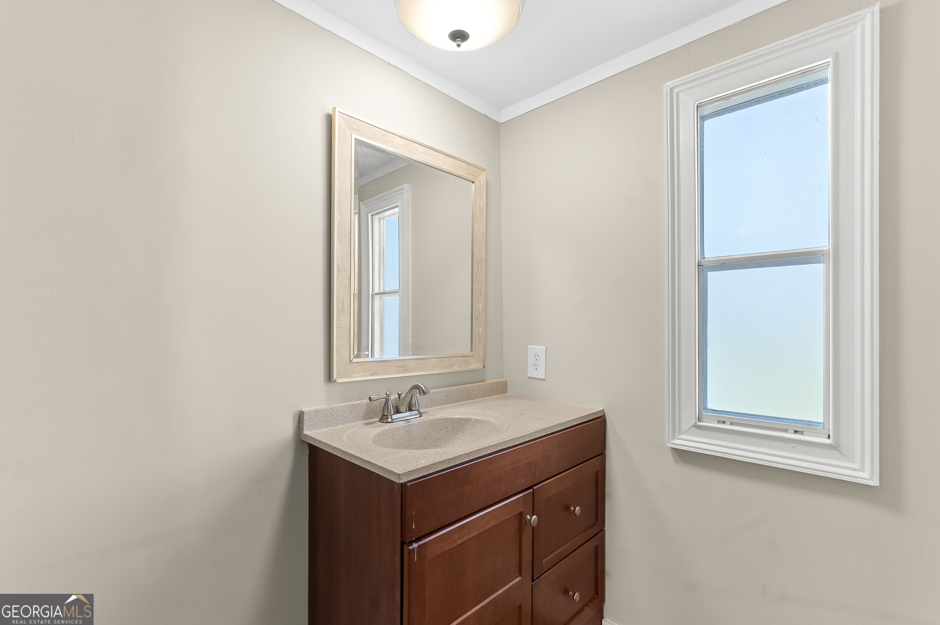 129 Walnut Street Bonaire, GA 31005 - Photo 25 of 31 a bathroom with a sink vanity and a mirror