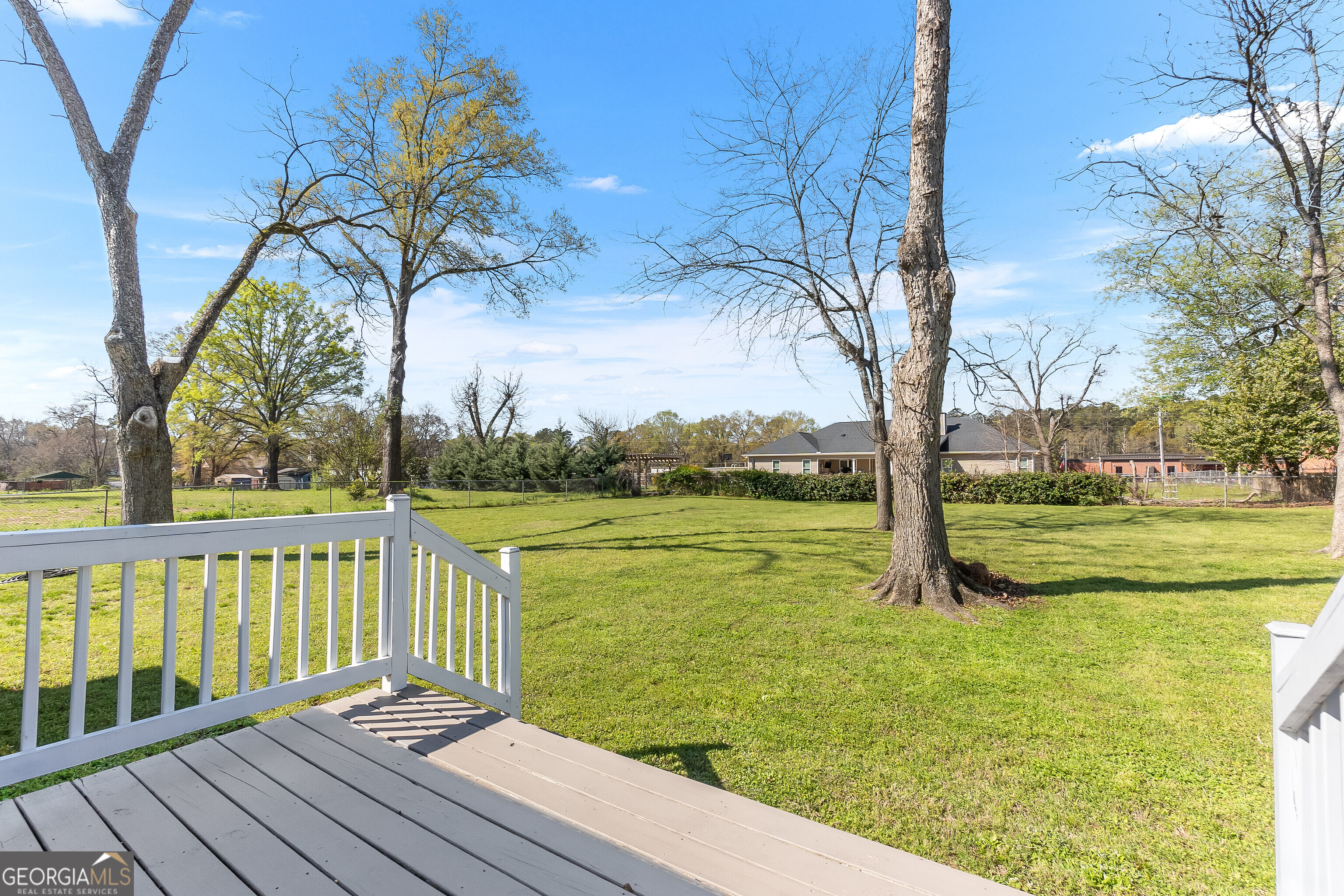 129 Walnut Street Bonaire, GA 31005 - Photo 26 of 31 a view of a lake with a garden