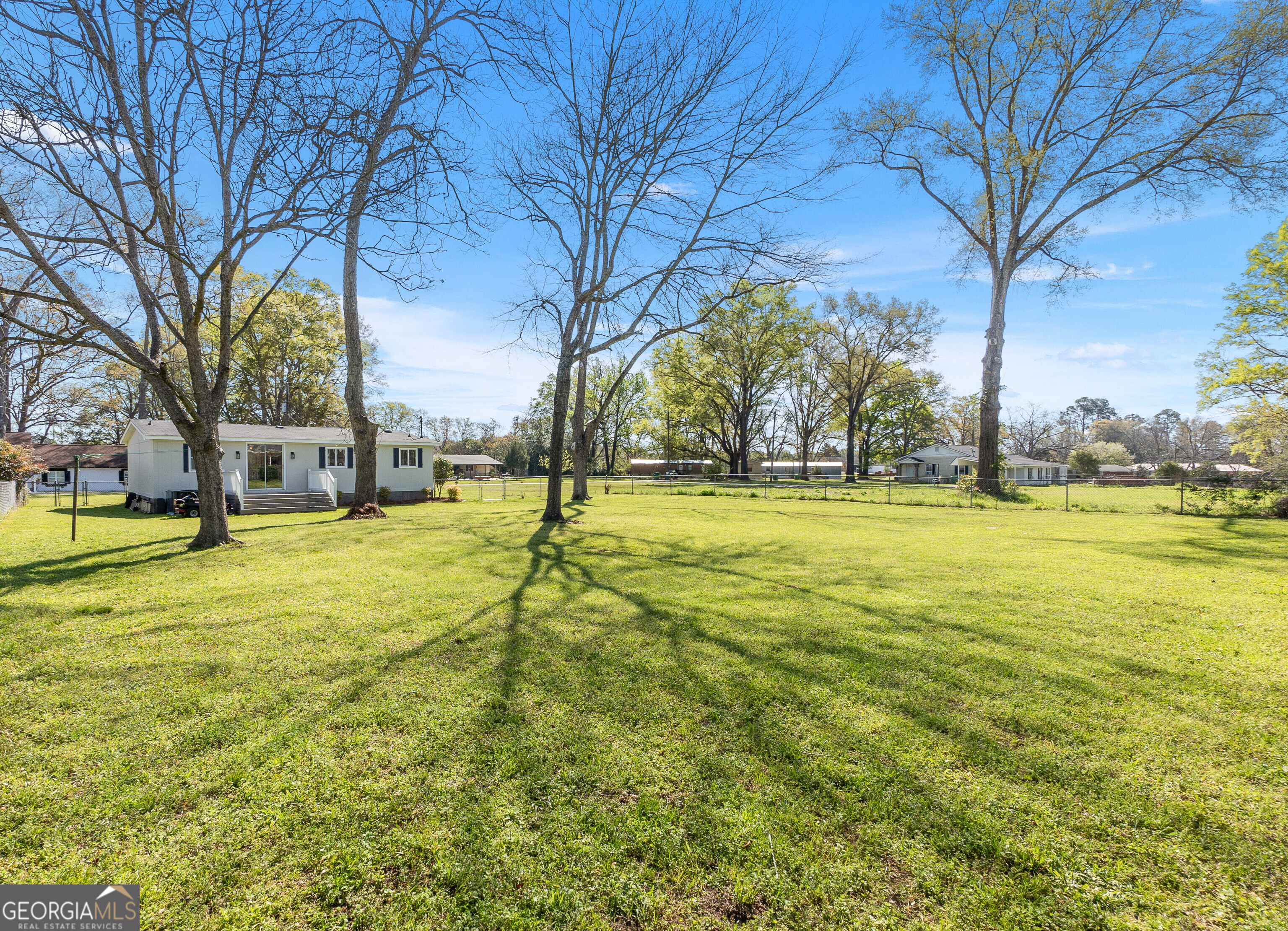 129 Walnut Street Bonaire, GA 31005 - Photo 30 of 31 a view of yard with swimming pool and tree