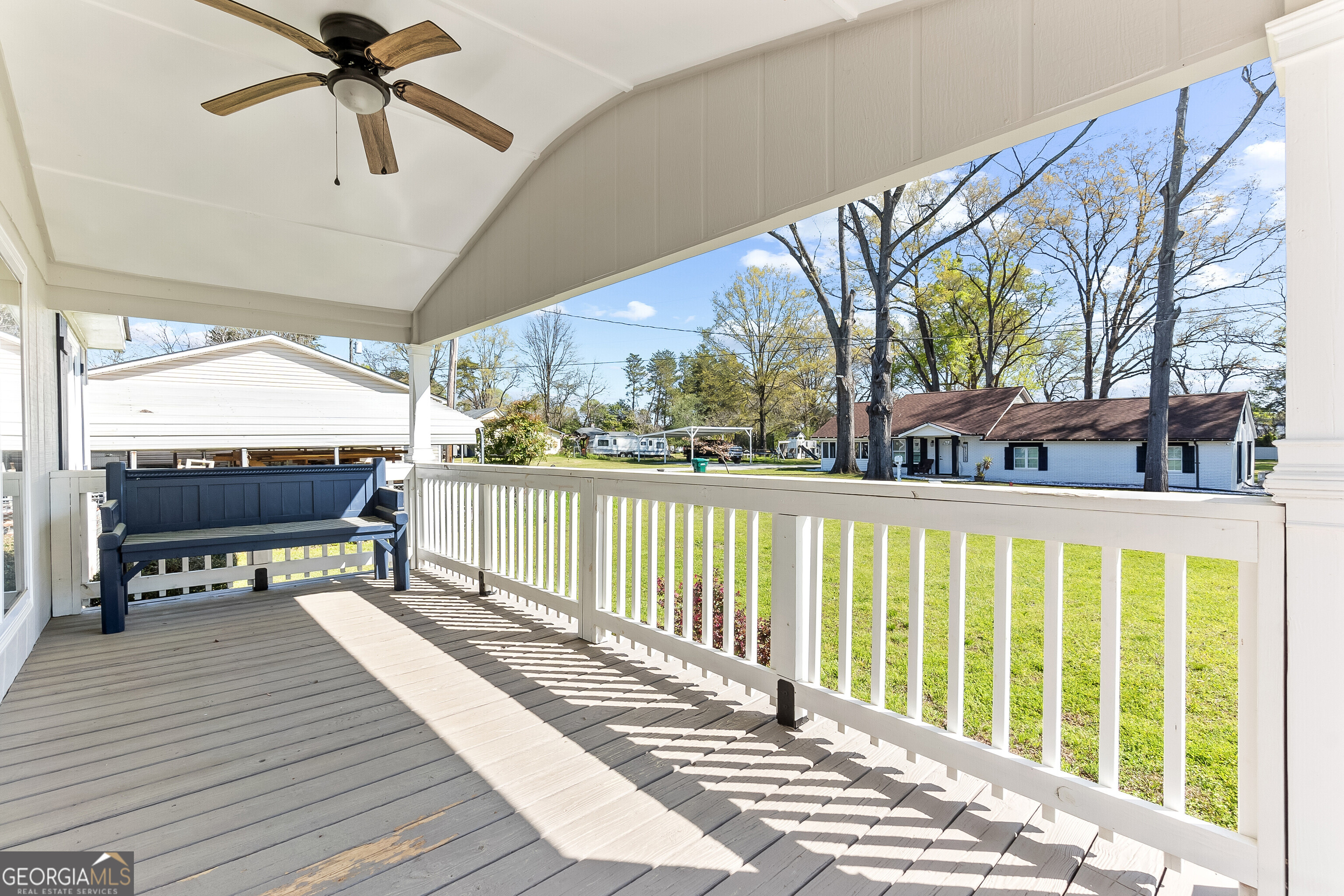 129 Walnut Street Bonaire, GA 31005 - Photo 3 of 31 a balcony with wooden floor table and chairs