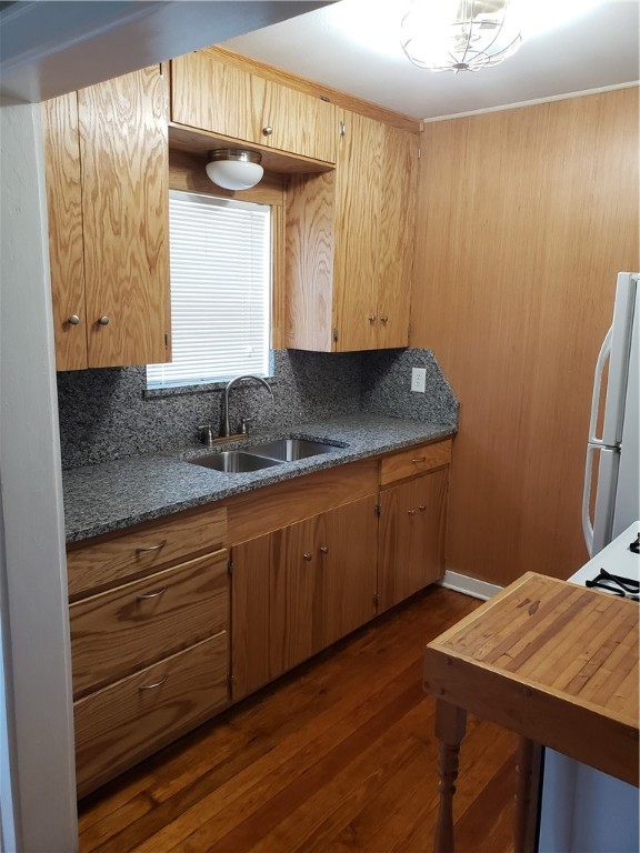 1806 2nd Street Corpus Christi, TX 78404 - Photo 2 of 7 a kitchen with stainless steel appliances granite countertop a sink cabinets and wooden floor