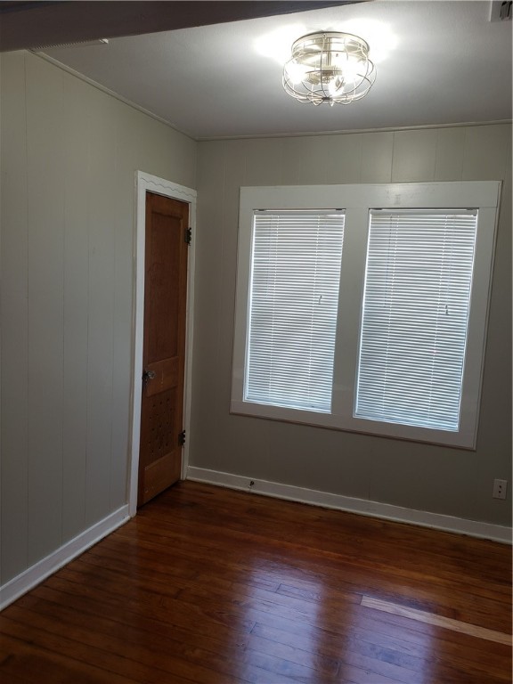 1806 2nd Street Corpus Christi, TX 78404 - Photo 4 of 7 an empty room with wooden floor and windows