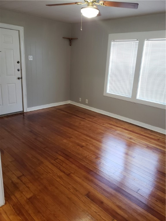 1806 2nd Street Corpus Christi, TX 78404 - Photo 6 of 7 an empty room with wooden floor and windows