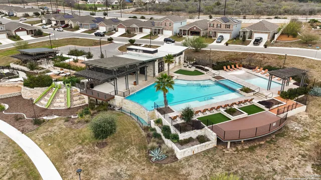 a view of a backyard with sitting area
