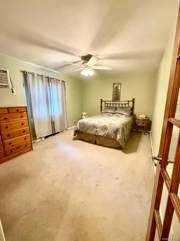 a bedroom with a bed and a walk in closet