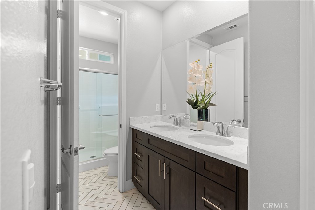 20948 Center Street Riverside, CA 92507 - Photo 13 of 92 a bathroom with a sink and a mirror