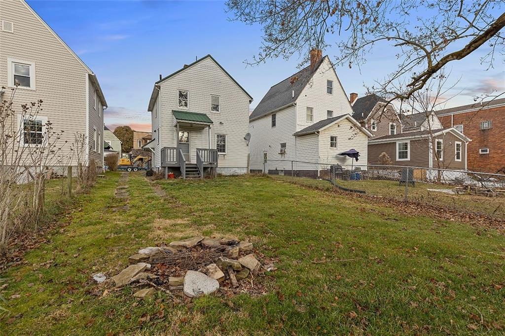 1809 Main Street Aliquippa, PA 15001 - Photo 20 of 24 a large white house with a big yard and large trees