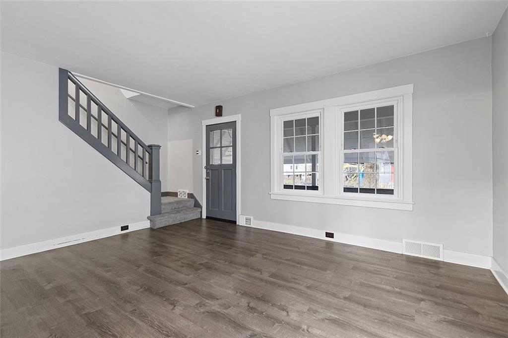 1809 Main Street Aliquippa, PA 15001 - Photo 2 of 24 a view of an empty room with wooden floor and a window