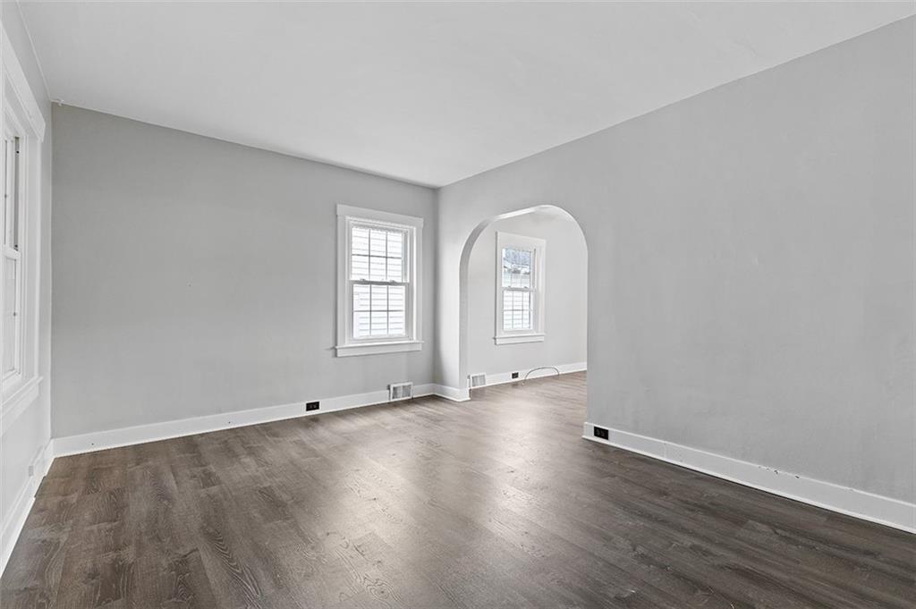 1809 Main Street Aliquippa, PA 15001 - Photo 3 of 24 an empty room with wooden floor and window