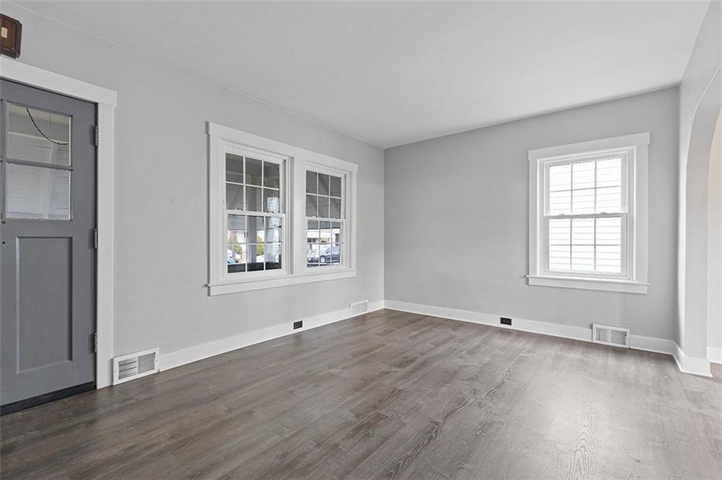1809 Main Street Aliquippa, PA 15001 - Photo 4 of 24 an empty room with wooden floor and windows