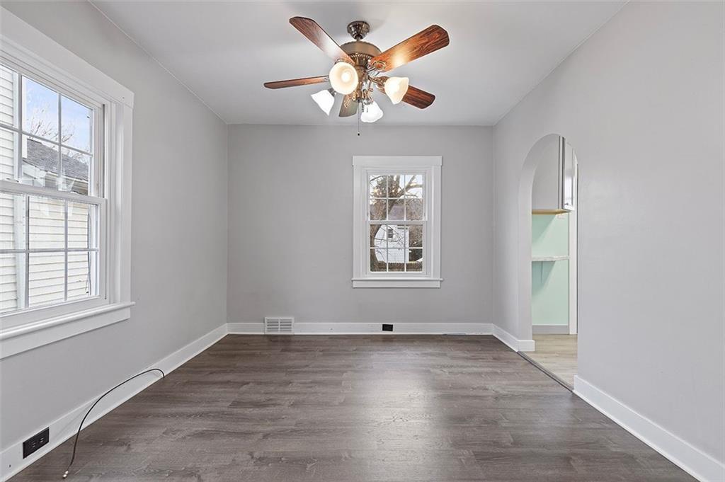 1809 Main Street Aliquippa, PA 15001 - Photo 6 of 24 an empty room with windows and chandelier fan