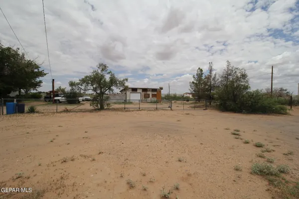 a view of a road with a building in the background