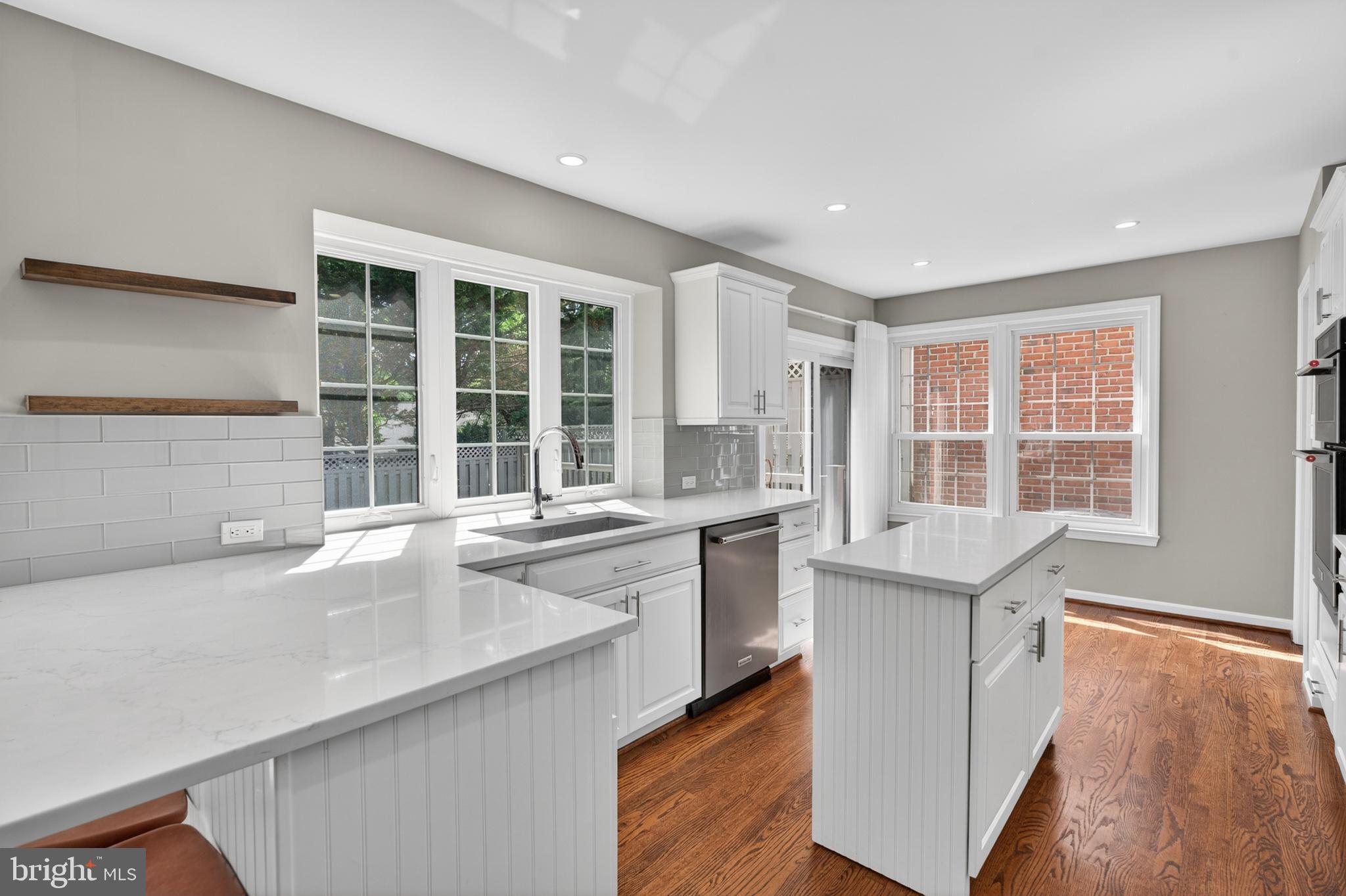 6 Nearfield Road Lutherville-Timonium, MD 21093 - Photo 25 of 71 a open kitchen with granite countertop a sink and dishwasher with wooden floor
