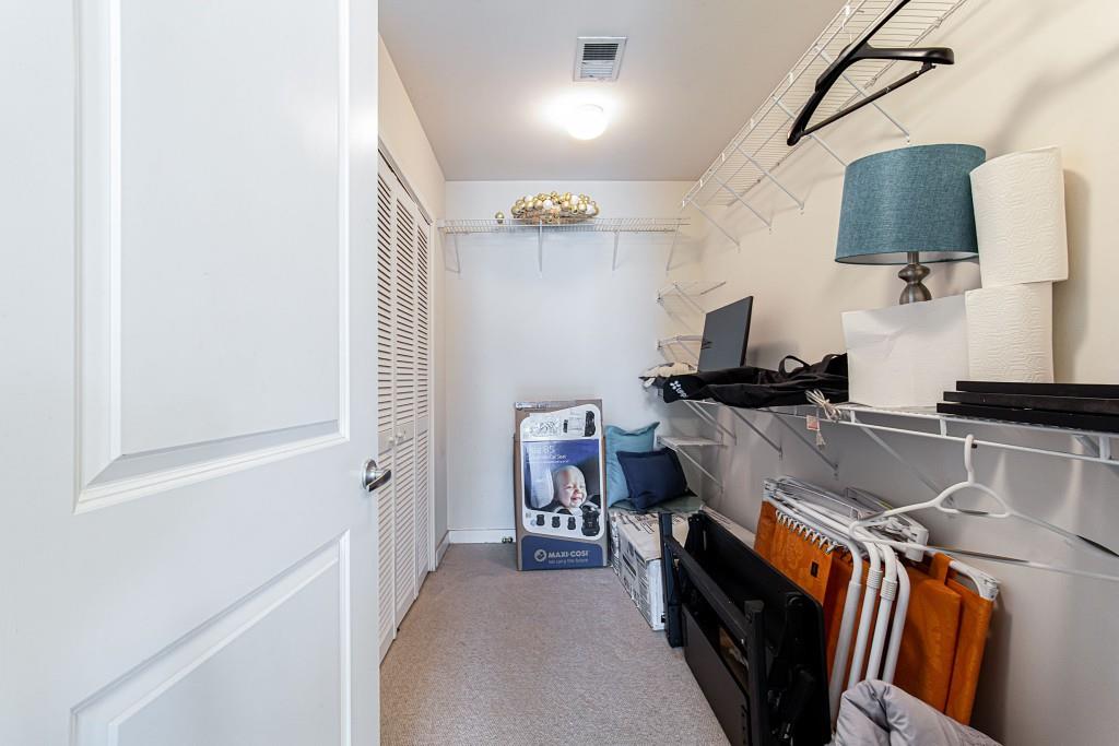 250 Pharr Road Northeast, Unit 216 Atlanta, GA 30305 - Photo 15 of 38 a view of a hallway with workspace and a window