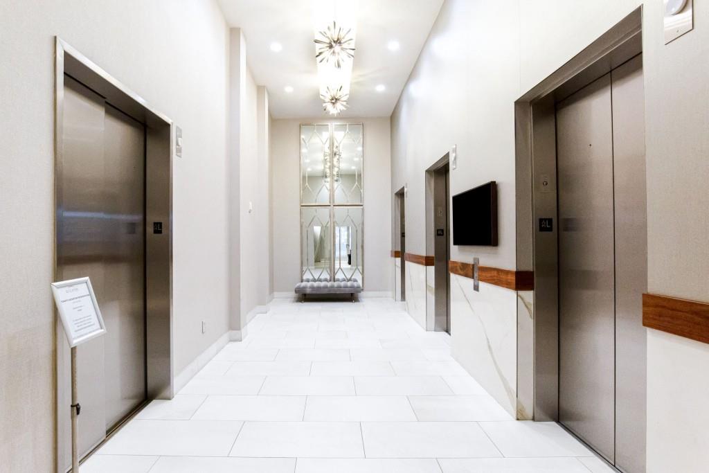 250 Pharr Road Northeast, Unit 216 Atlanta, GA 30305 - Photo 26 of 38 a view of a hallway with a flat screen tv