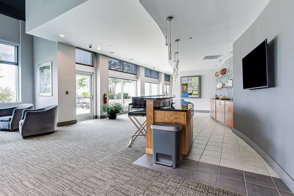 250 Pharr Road Northeast, Unit 216 Atlanta, GA 30305 - Photo 30 of 38 a living room with furniture and a flat screen tv