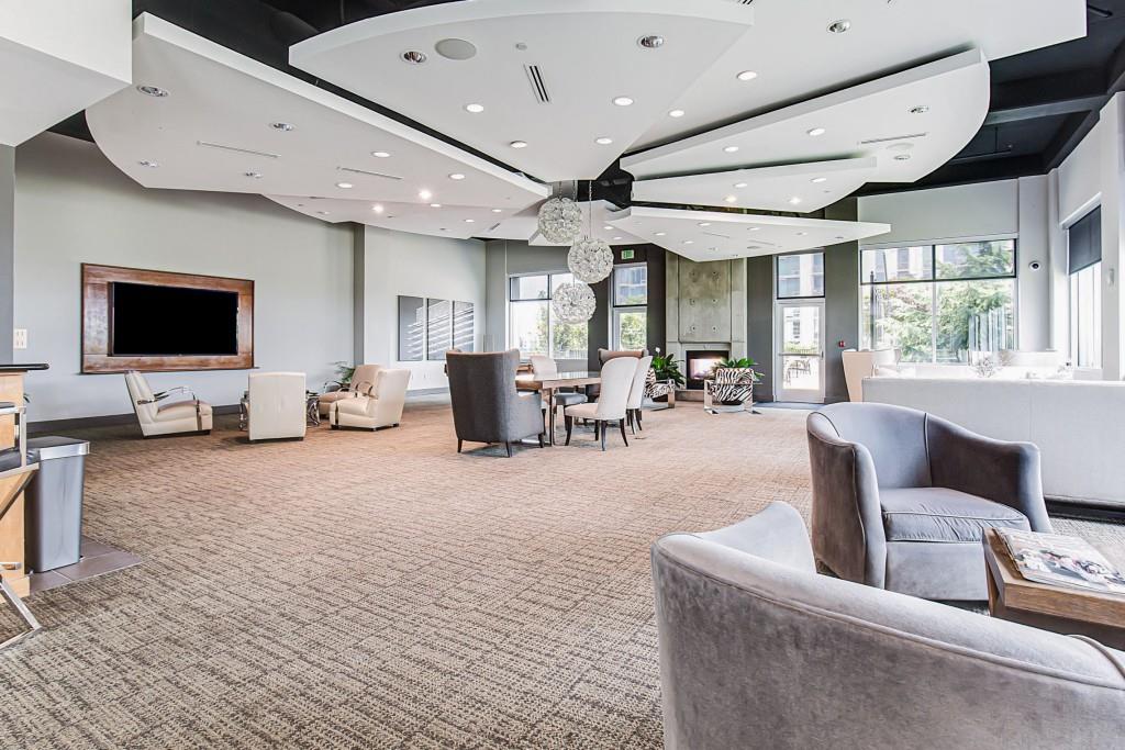 250 Pharr Road Northeast, Unit 216 Atlanta, GA 30305 - Photo 31 of 38 a living room with furniture and a flat screen tv