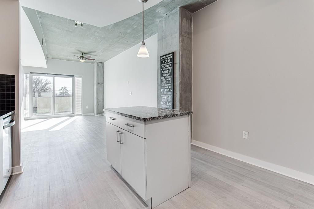 250 Pharr Road Northeast, Unit 216 Atlanta, GA 30305 - Photo 6 of 38 a view of a kitchen with a sink and a window