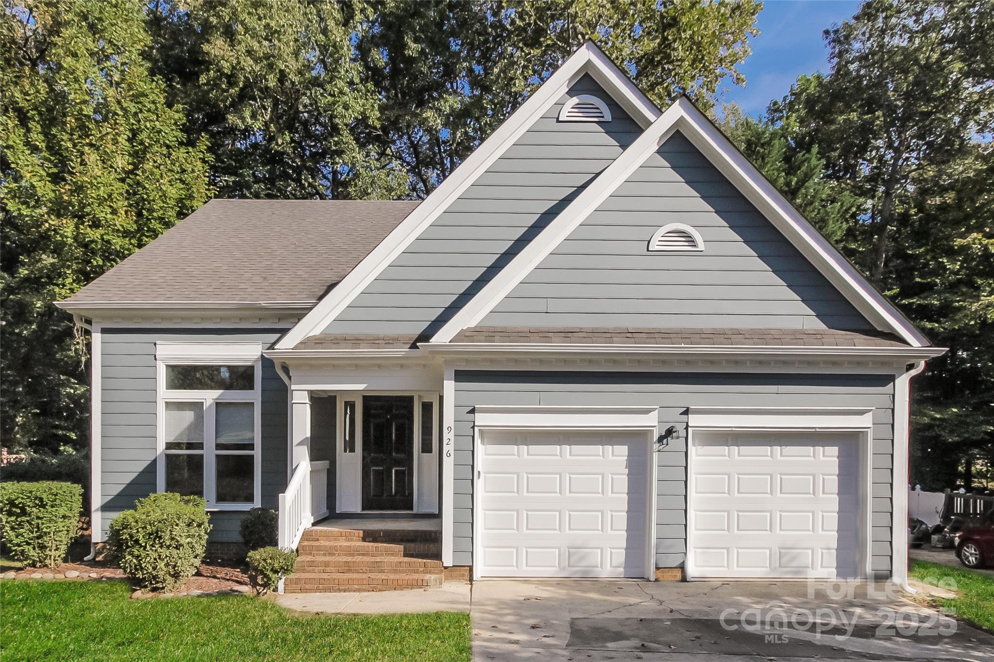 a view of front of house with a yard