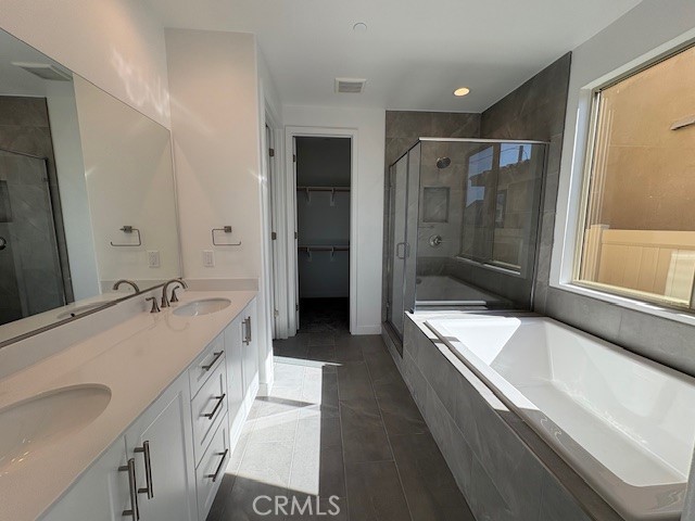 3706 Leafgreen Road Corona, CA 92883 - Photo 4 of 5 a spacious bathroom with a tub sink shower and mirror