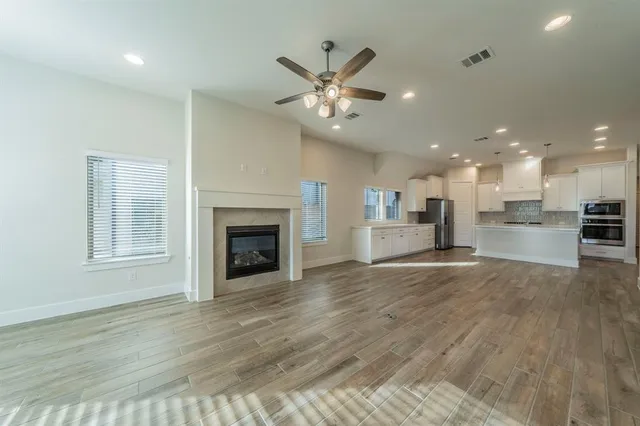 a view of an empty room and a window