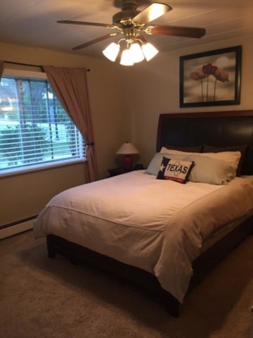 454 Spring Road, Unit 8 Elmhurst, IL 60126 - Photo 12 of 14 a bedroom with a bed and a window