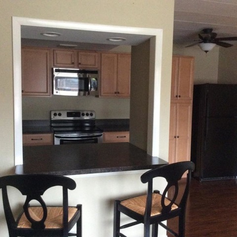 454 Spring Road, Unit 8 Elmhurst, IL 60126 - Photo 4 of 14 a kitchen with a table chairs and entryway