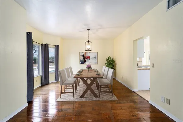 a kitchen with stainless steel appliances kitchen island granite countertop a refrigerator and stove