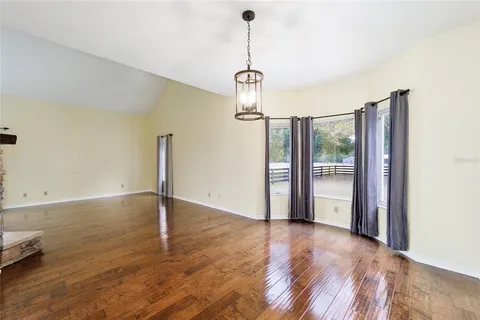 a kitchen with stainless steel appliances granite countertop a refrigerator a sink and a stove