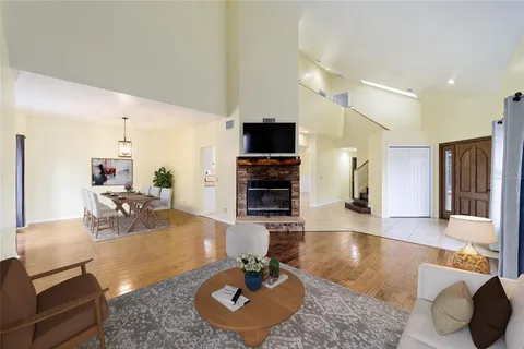 a view of a dining room with furniture window and wooden floor