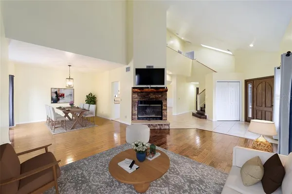 a view of a dining room with furniture window and wooden floor