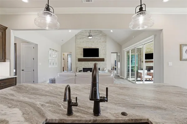a view of a livingroom with furniture and a flat screen tv