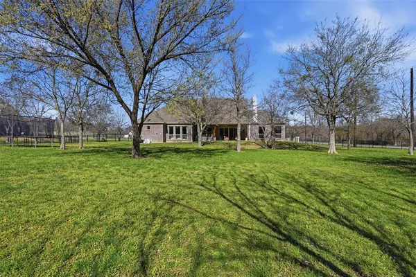 a view of a house with a big yard