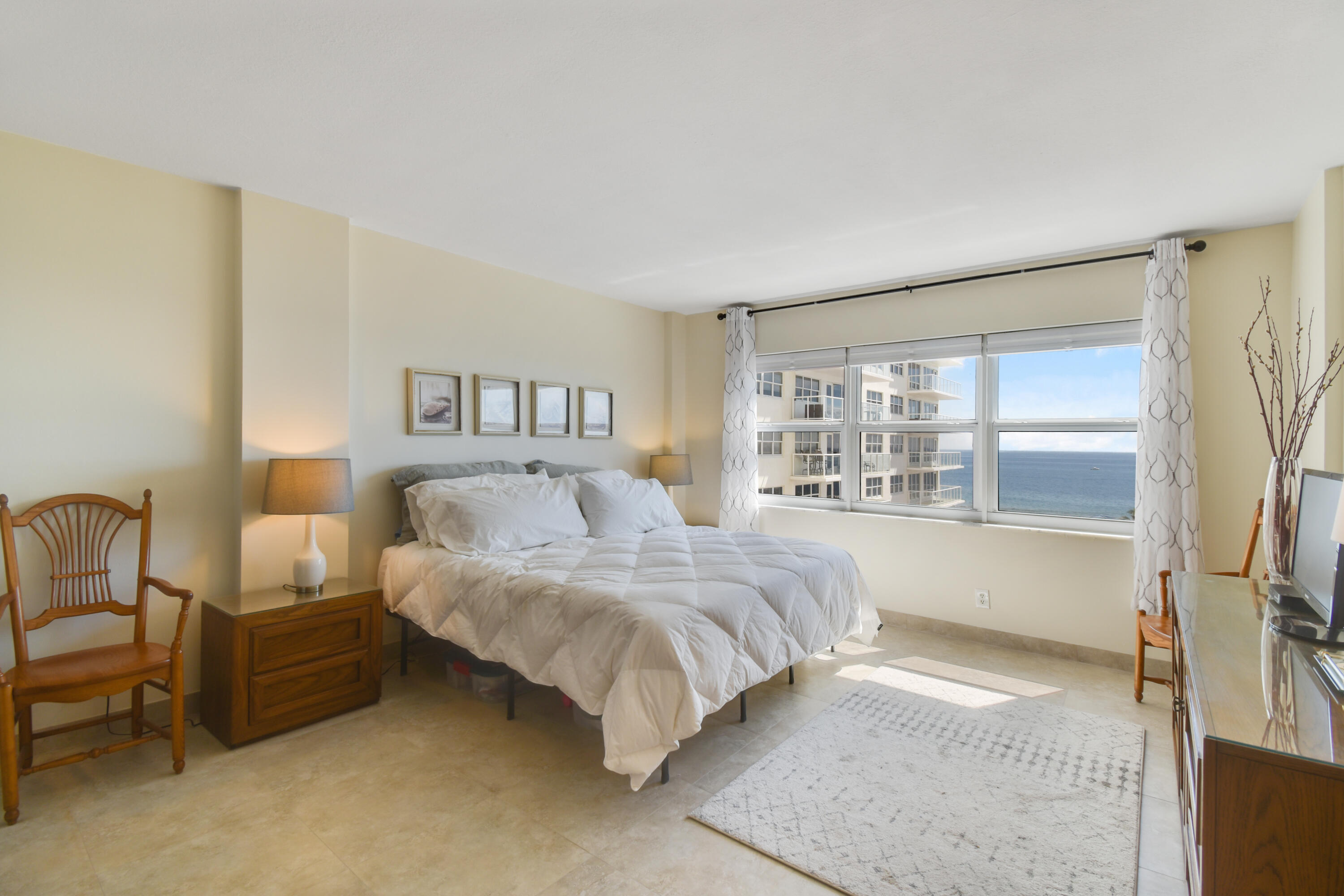 111 North Pompano Beach Boulevard, Unit 811 Pompano Beach, FL 33062 - Photo 16 of 24 a bedroom with bed and large window