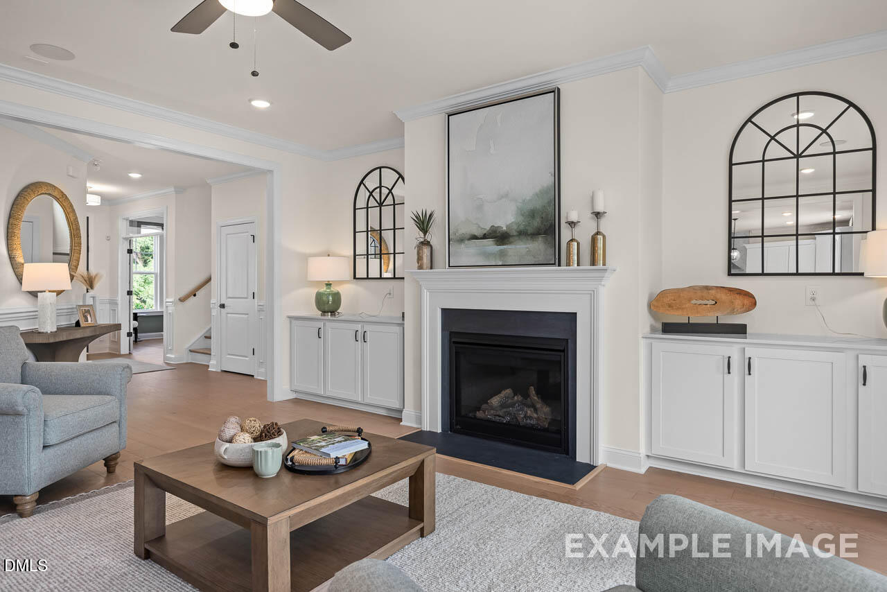 83 Crop Road Angier, NC 27501 - Photo 11 of 40 a living room with furniture and a fireplace
