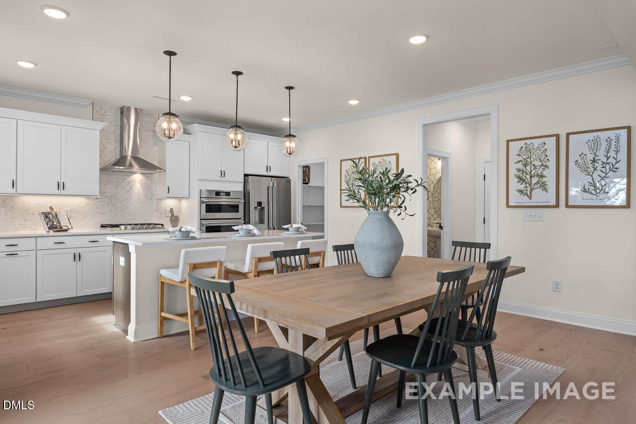 83 Crop Road Angier, NC 27501 - Photo 12 of 40 a view of kitchen with cabinets and wooden floor