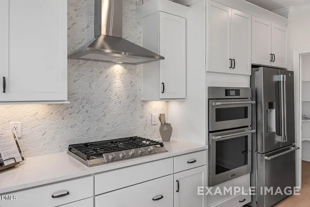 a stove top oven sitting inside of a kitchen