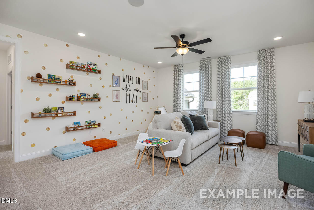 83 Crop Road Angier, NC 27501 - Photo 24 of 40 a living room with furniture and a window
