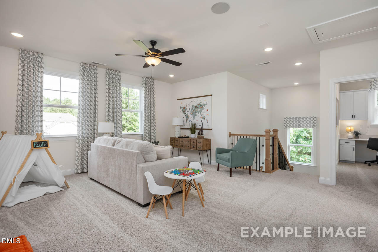 83 Crop Road Angier, NC 27501 - Photo 25 of 40 a living room with furniture a window and gym equipment