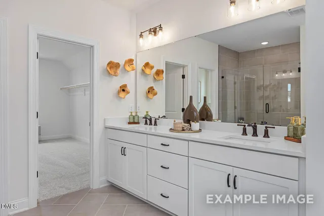 a bathroom with a double vanity sink mirror and