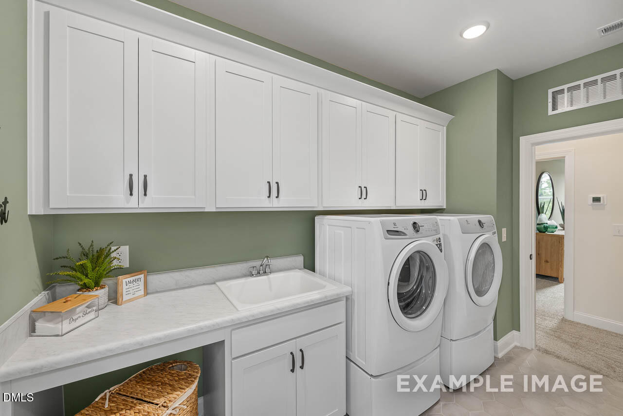 83 Crop Road Angier, NC 27501 - Photo 31 of 40 a utility room with dryer and washer