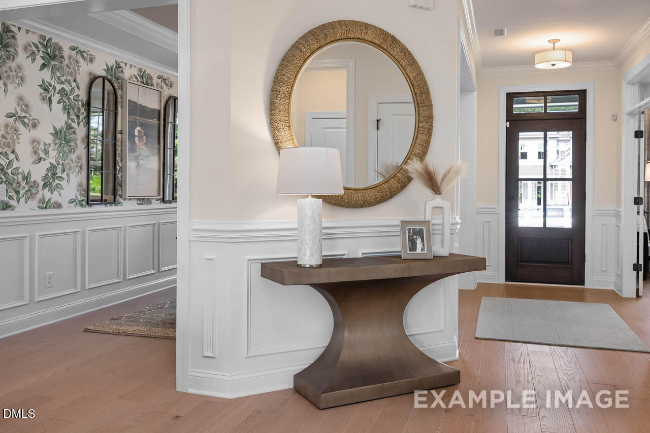 83 Crop Road Angier, NC 27501 - Photo 6 of 40 a living room with furniture a mirror and a clock