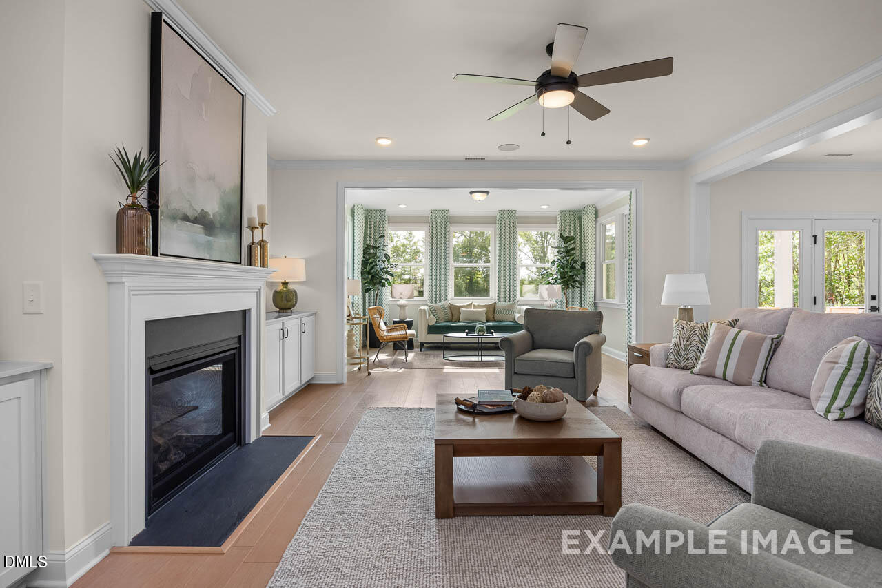 83 Crop Road Angier, NC 27501 - Photo 7 of 40 a living room with furniture and a fireplace