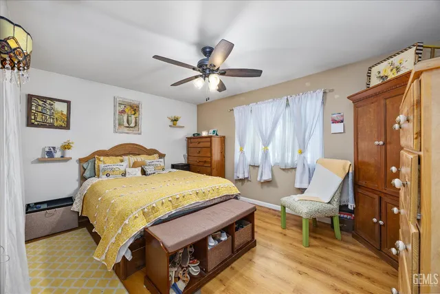 a bed room with a bed and a chandelier